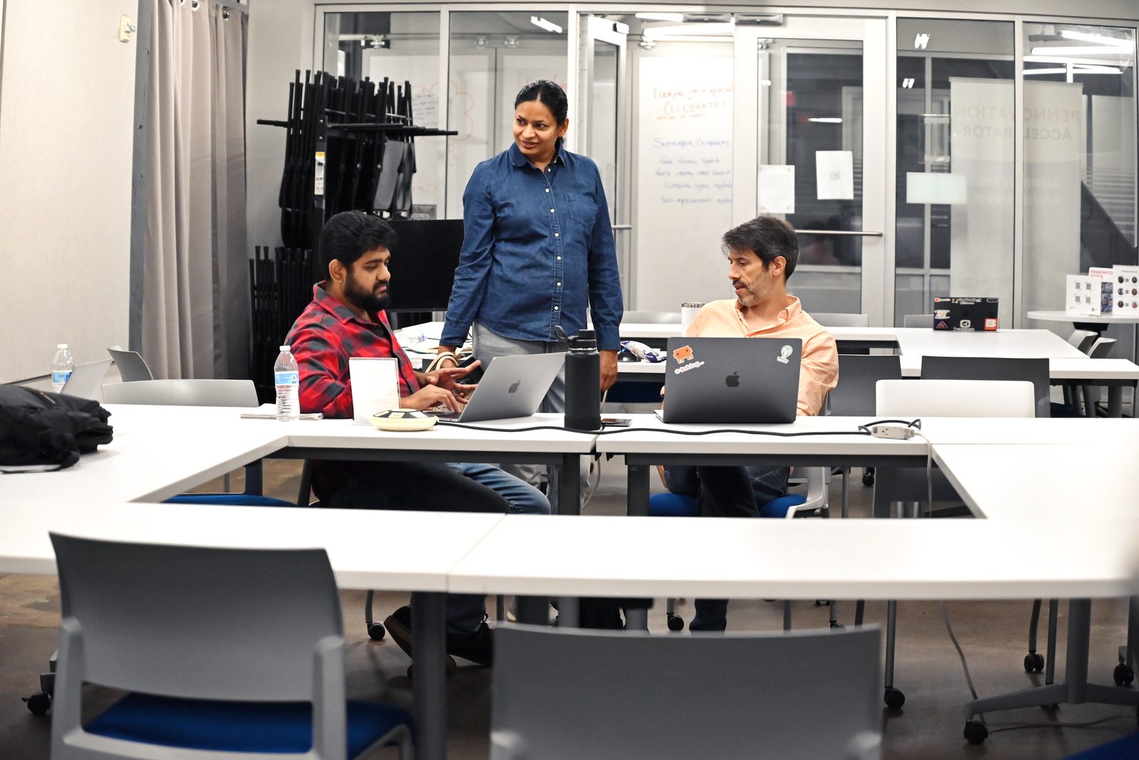 A team working on laptops